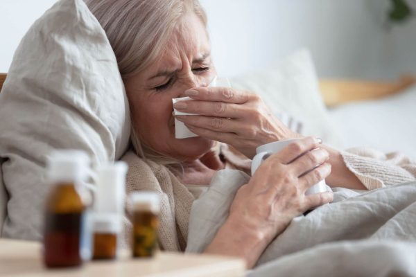 Women with flu in bed