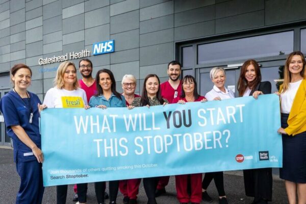 Group photo of Stoptober campaigners with banner