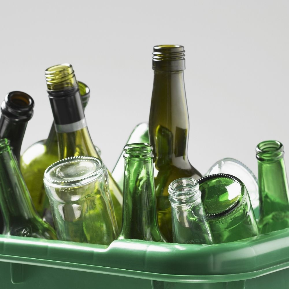 empty glass bottles in trash